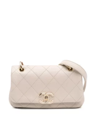 A beige quilted leather Chanel Pre-Owned Mini Square Classic Lambskin Single Flap Crossbody Bag with a gold chain strap and a gold interlocking "CC" logo on the front flap.
