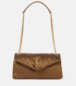 A brown Saint Laurent Voltaire Mini Leather Shoulder Bag with a flap closure, gold YSL logo, gold-tone chain shoulder strap, and a repeating circular pattern on the fabric. The bag is displayed against a plain white background.