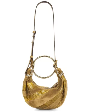 A brown and gold striped suede handbag with a wide circular metal handle and an adjustable shoulder strap, this bag channels the luxe feel of a Chloé Embellished Leather Shoulder Bag with its slouchy, crescent shape and metallic accents.