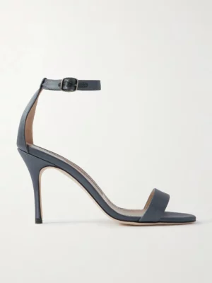 A single dark gray high-heeled sandal, inspired by the Manolo Blahnik Hangisi 90 Pump, features a thin ankle strap with buckle, open toe, and slim stiletto heel, shown in side profile against a plain light background.