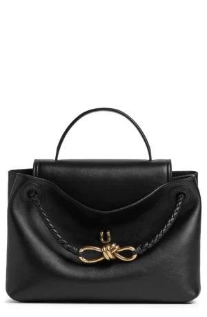 A black Bottega Veneta Parachute Medium Intrecciato Leather Shoulder Bag with a top handle, braided shoulder strap, and gold-tone hardware featuring a knot-shaped clasp on the front.