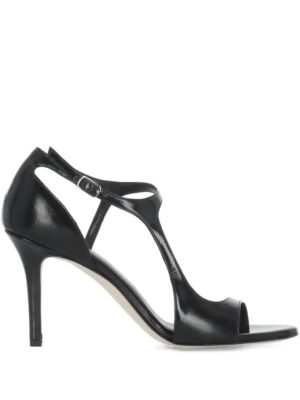 A black high-heeled sandal with an open toe, back strap, adjustable buckle, and a slim stiletto heel. Inspired by The Seller 100mm Glitter T-Bar Sandals, it features a glossy finish and minimalist design.