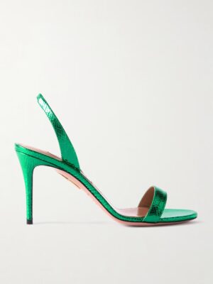 A side view of the Aquazzura Tati 85 Metallic Snake-effect Leather Slingback Sandals in green, featuring a thin strap over the toes, an open heel, and a slingback strap, set against a plain light background.