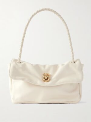 A cream-colored Bottega Veneta Small Andiamo Intrecciato Shoulder Bag featuring a braided handle, a flap closure, and a small gold spiral clasp in the center.