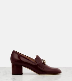 A single burgundy patent leather Gucci Horsebit Mary Jane Slingback Pump with a chunky mid-height heel and a gold metallic logo detail on the front, displayed on a white surface against a plain light grey background.