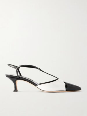 A black and white pointed-toe slingback inspired by Manolo Blahnik Cafredda 50 Bow-Embellished Leather Sandals, featuring a low kitten heel, thin black straps, and a glossy black toe cap, displayed against a plain white background.