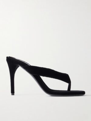 A black high-heeled sandal inspired by the Alaïa 90 Velvet Mules, featuring a thong strap design, open toe, stiletto heel, and a minimalist, modern silhouette.