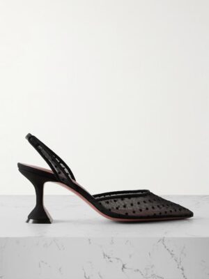 A black slingback heeled shoe with a pointed toe, mesh polka dot upper, and sculpted geometric heel, inspired by the elegance of Amina Muaddi Adut crystal-embellished buckled patent-leather sandals, sits on a white marble surface.