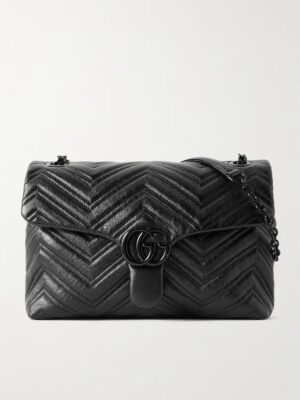 A black Gucci GG Marmont Quilted Leather Shoulder Bag with a chevron pattern, flap closure, black double-G logo hardware, and a chain strap, displayed against a plain light background.