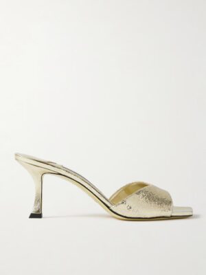 The Jimmy Choo Skye 70 Cracked Metallic Mules feature a gold, open-toe design with a mid-height stiletto heel and a textured metallic finish, shown in profile against a plain white background.