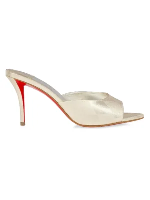 A high-heeled mule sandal, the CHRISTIAN LOUBOUTIN Miss Z Ocelot Lurex and Leather-Trimmed Sequined Satin Mule features an open toe, metallic light gold upper, red sole, and thin stiletto heel. Photographed from the side against a white background.