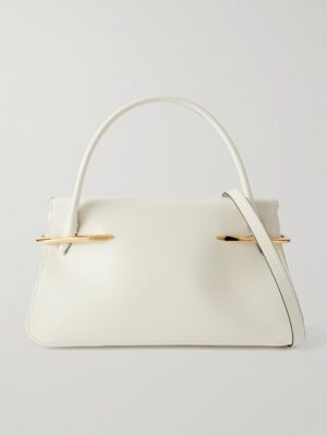 A structured white Givenchy Pinch Medium Leather Tote Bag with a top handle, detachable shoulder strap, and gold-toned hardware accents on each side, displayed against a plain light background.