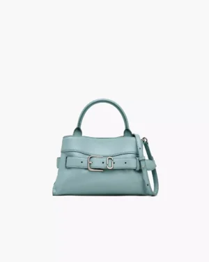 A light blue Marc Jacobs The Everyday Mini Vanity Bag in leather, featuring a top handle, front buckle detail, and adjustable shoulder strap, displayed against a plain white background.
