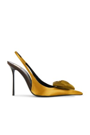 A mustard yellow satin Saint Laurent Malika Heeled Sandal with a pointed toe, high stiletto heel, and a decorative bow on the front, photographed against a white background.